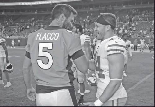 DENVER BRONCOS quarterback Joe Flacco (5) greets San Francisco 49ers fullback Kyle Juszczyk (44) after an NFL preseason game Monday in Denver. The 49ers won 24-15. (AP Photo)