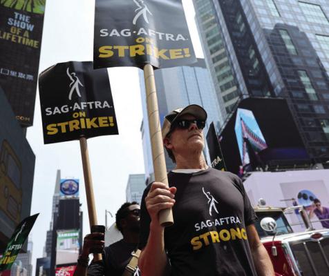 KEVIN BACON and fellow SAG-AFTRA members and supporters picket in front of Paramount Studios on Monday, July 17, 2023, in New York. (Michael Loccisano/Getty Images/TNS)