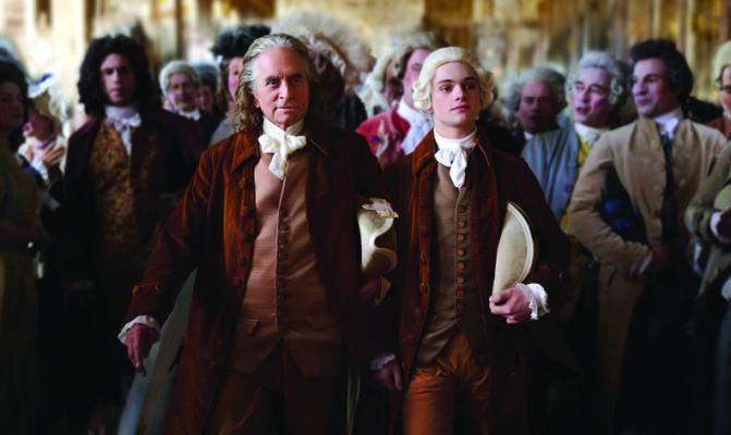 MICHAEL DOUGLAS, left, as Benjamin Franklin and Noah Jupe as his grandson, Temple, in “Franklin.” (Rémy Grandroques/Apple TV+/TNS)