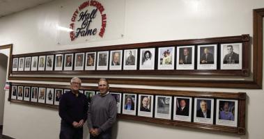 The Po-Hi Alumni Hall of Fame Committee is seeking nominations for the 2024 Alumni Hall of Fame Induction Ceremony. This wall, located on the second floor of the Ponca City High School, features all those honored in past years. Pictured left to right are Larry Murphy and Allen Hardesty, whose contact information for the nominations is included in the article below. (Photo by Calley Lamar)