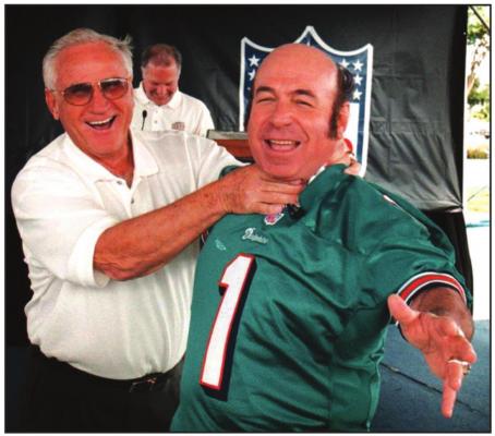 COACH DON Shula and kicker Garo Ypremian, right, clown around during a reunion of the 1970s Miami Dolphins. Ypremian kicked the winning field goal in the 1971 AFC Championship game against the Kansas City Chiefs, which is the longest football game ever played.