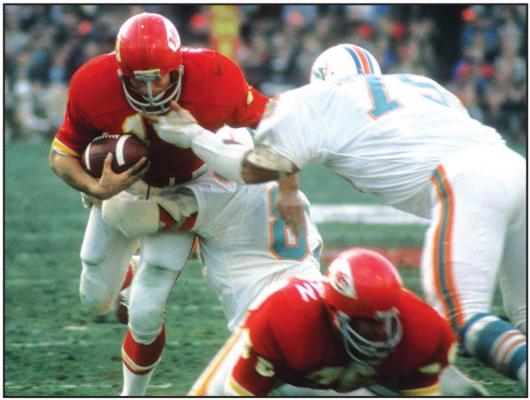 ED PODOLAK of the Kansas City Chiefs carries the ball against the Miami Dolphins in the 1971 Christmas game that decided the AFC Championship. Podolak was one of the stars of the game, but his team was the loser in overtime.