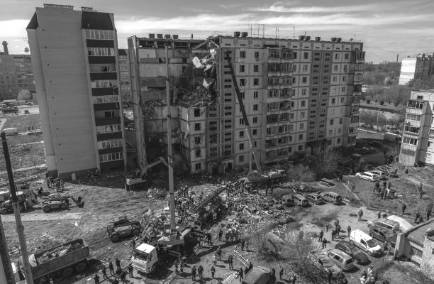 Firefighters work on the site of the destroyed residential building following the Russian attack, on April 28, 2023, in Uman, Ukraine. Authorities said at least 16 people died, including three children, when a Russian rocket hit the building this morning, part of a wave of Russian missiles launched at several Ukrainian cities. It was the first large-scale aerial attack in more than a month. (Roman Pilipey/Getty Images/TNS)