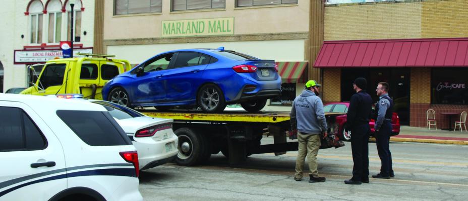 AN ACCIDENT occurred on Grand Ave. near 5th Street around approximately 1 pm on Thursday, Jan. 25, when a single vehicle collided with several parked cars. Police blocked off Grand Ave. between 4th and 5th Streets as the vehicle was removed from the scene. (Photo by Calley Lamar)