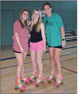 Haleigh George, Alli Arnold and Morgan Bonnarens were the first of the skates to hit the basketball court, what became a makeshift skating rink, for the Ponce City Rec Plex’s first Family Fun Night Saturday, Aug. 27. (Photo Everett Brazil III)