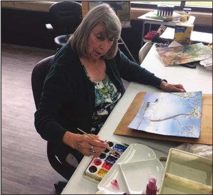PICTURED IS “City Arts” very own in-house artist, Elaine Armstrong. Armstrong’s specialty is watercolor and her artwork will be seen and available at the upcoming event, Arts Crawl, in downtown Ponca City. (Photo provided by Hayley Harrison of Ponca City Arts Association).