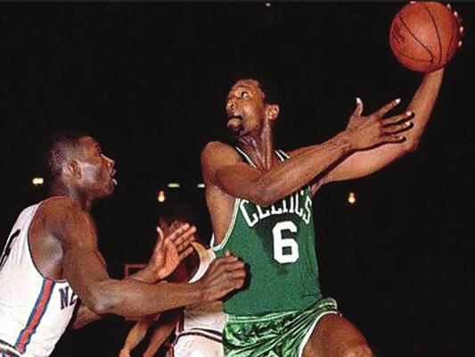 BILL RUSSELL (6) is shooting in this action photo. Russell was known more for his defensive play, especially rebounding, than he was for scoring points. Some say he may have been the best rebounder of all time.