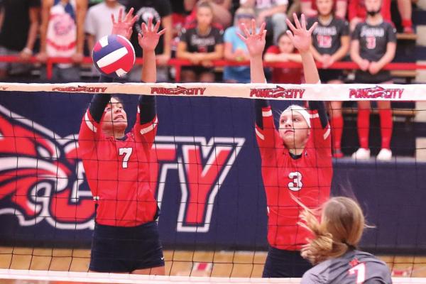 LADY CAT blockers Naomi Gertken (7) and Baylee York (3) do their job at the net during Tuesday’s varsity volleyball match with Norman at Robson Field House. Norman won in three sets, 25-16, 25-18, 26-24. This photo was provided by Larry Williams.