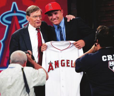 IN THIS JUNE 9, 2009, file photo, Baseball Commissioner Bud Selig poses with Mike Trout, an outfielder from New Jersey’s Millville High School, who was picked 25th by the Los Angeles Angels in the baseball draft in Secaucus, N.J. Baseball’s amateur draft this week will look much different because of the coronavirus pandemic, and more permanent changes could be coming soon. (AP Photo/Rich Schultz, File)