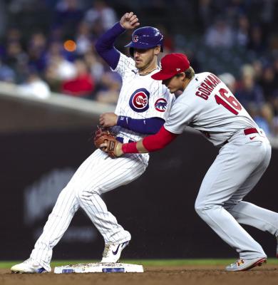 ST. LOUIS Cardinals second baseman Nolan Gorman (16) tags out Chicago Cubs baserunner Cody Bellinger as Bellinger is caught stealing to end the third inning at Wrigley Field on Tuesday, May 9, 2023, in Chicago. (Chris Sweda/Chicago Tribune)