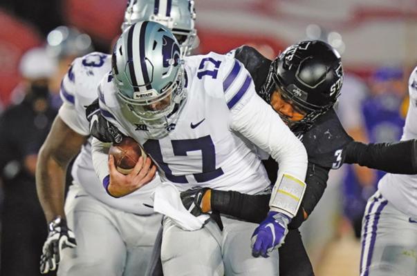Kansas State quarterback Nick Ast (17) is sacked by Iowa State defensive end JaQuan Bailey (3) during the second half of an NCAA college football game, Saturday, Nov. 21, 2020, in Ames, Iowa. Iowa State won 45-0. (AP Photo/Charlie Neibergall)