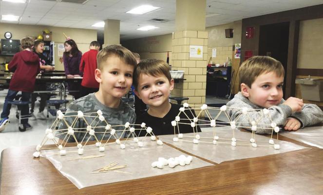 CAT CARE participants are pictured during an activity to celebrate STEM (Science, Technology, Engineering and Math). Pictured, from left, are Easton Fisher, Aden Montenegro and Seth Greenhagen.