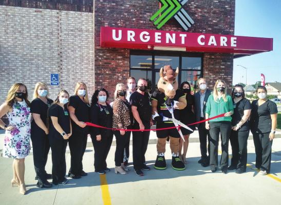 THE CHAMBER held a ribbon cutting ceremony for the new Xpress Wellness Urgent Care located at 2501 N. 14th Street. Cutting the ribbon is their mascot Pronto along with Chief Medical Officer Dr. Scott Williams and CEO Grant Asay. They are also shown with their medical team. They officially opened for business on Monday.