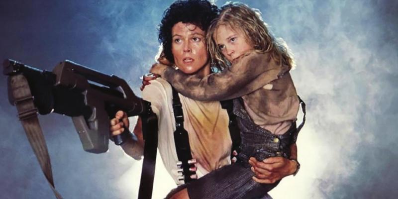 Ellen Ripley, played by Sigourney Weaver, and Newt, played by Carrie Henn, Aliens, 1990, 20th Century Fox.