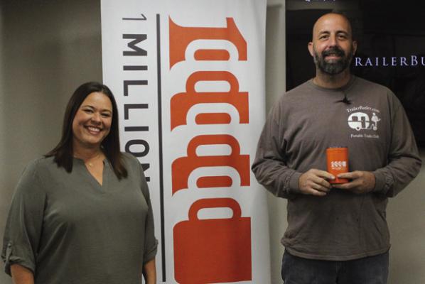 OCTOBER’S 1 Million Cups event featured Trailer Butler owner Troy Ormonde (right) as speaker. He is pictured with Brook Lindsay (left), who presented Ormonde with a orange cup that is given to speakers at 1 Million Cups events. (Photo by Calley Lamar)
