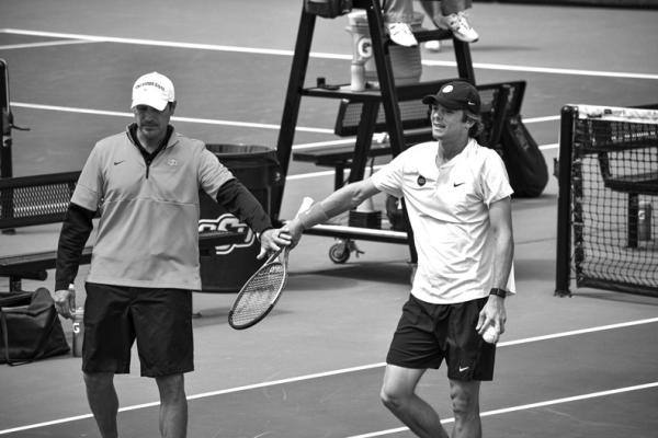 OSU coach Dustin Taylor’s (left) goal is to develop his tennis players into future professionals. OSU file photo.