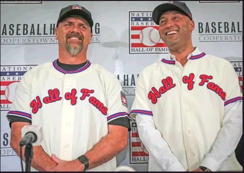 NEW YORK Yankees shortstop Derek Jeter, right, and Colorado Rockies outfielder Larry Walker pose after receiving their Baseball Hall of Fame Jerseys this week during a news conference in New York. (AP Photo)