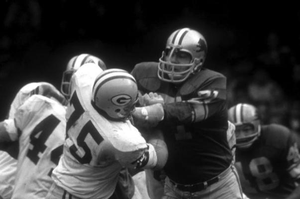ALEX KARRAS was a ferocious tackler during his career with the Detroit Lions, Here he plys his trade against the Green Bay Packers. Karras still holds the Lions career record for quarterback sacks.