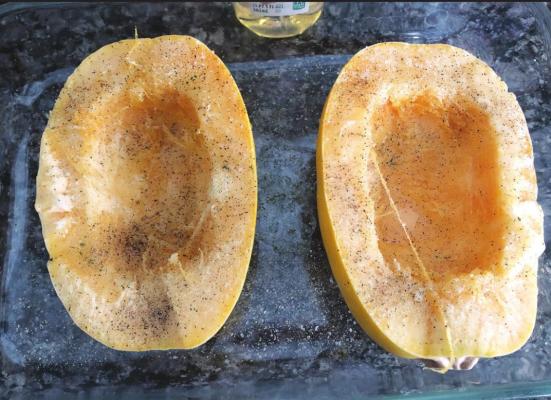 TO PREPARE your spaghetti squash, cut it in half and scoop out the seeds. Pour olive oil on it and sprinkle salt and pepper. Put in the microwave and cook for 25 minutes. (News Photo by Kristi Hayes)