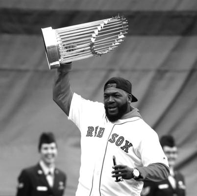 DAVID ORTIZ of the Boston Red Sox celebrates after his team won a World Series. Ortiz, known by his fans as “Big Papi” served as a DH for many years.