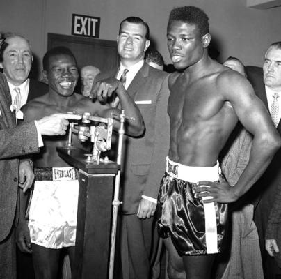 BENNY PARET, boxer on the left, and Emile Griffith are seen at the weigh-in leading up to their boxing match. Griffith pounded Paret into submission during the fight and Paret died from the injuries he suffered. Paret uttered some homophobic slurs aimed at Griffith during the weigh-in. Death is no stranger to the sport of boxing.