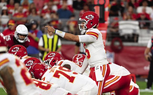 KANSAS CITY Chiefs quarterback Patrick Mahomes (15) points at the defense while getting ready to take the snap from under center during the first quarter of a preseason game against the Arizona Cardinals at State Farm Stadium on Saturday, Aug. 19, 2023, in Glendale, Arizona. (Norm Hall/Getty Images/TNS)