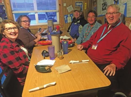 Ponca City members Barbara and John Davis, Lowry and Rebecca Blakeburn, and Jon Tippin await their steak dinner at Buck’s BBQ in Sedan, KS.