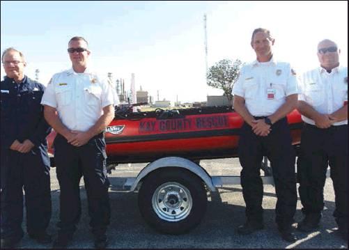PHILLIPS 66 DONATED funds to purchase a Swift Water Rescue Boat and Trailer in memory of the late Larry Larimore. Pictured, from left, are Darin Fields, Manager of Ponca City Refinery, Justin Kienzle, Tonkawa Fire Department, Cory Hanebrink, Blackwell Fire Department and Adam Longcrier, Newkirk Fire Department.
