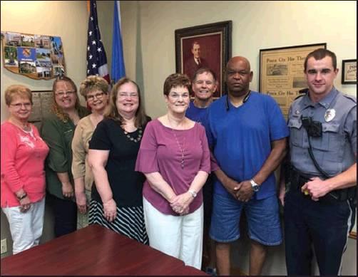 IN OBSERVANCE of September being Crime Stoppers Month, the Ponca City Area Crime Stoppers Board met to discuss current and upcoming events. Pictures are (l-r) board members, Harriett Simpson, Tina Stracener, Kelly Ailey, Tamara Wink, Carole Jeffries, Larry Bittman, and Dwain West. Also pictures is PCPD Cpl. Cody Womack, School Resource Officer for East and West Middle Schools. (Courtesy Photo)