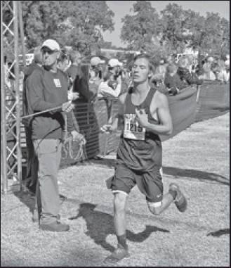 FRONTIER HIGH School cross country runner Chandler Sanders placed 36th in the Class 2A State Championships recently at Gordon Cooper Technology Center in Shawnee. Here he is shown crossing the finish line.