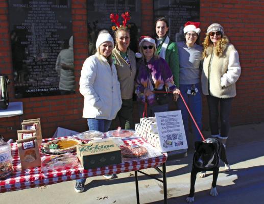 THE DOGGONE Christmas Party and Fundraiser benefiting the Northern Oklahoma Humane Society (NOKHS) was held on Saturday, Dec. 9 with two events. The first of these events (pictured) was held at the Ice on the Plaza in downtown Ponca City from 12 pm to 4 pm. While the second event was held at Vortex Alley Brewing, located at 220 E. Central Ave., from 4 pm onward with an ugly sweater/ onesie party. (Photo by Calley Lamar)