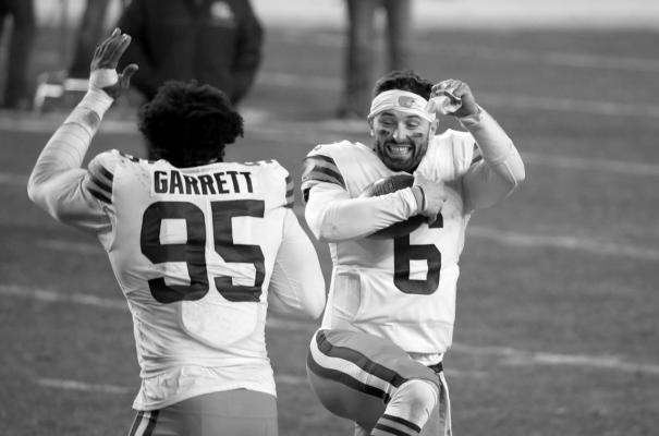 The Cleveland Browns’ Baker Mayfield (6) and Myles Garrett (95) celebrate a 48-37 victory against the Pittsburgh Steelers in an AFC Wild Card Playoff game at Heinz Field in Pittsburgh on January 10, 2021. (Justin K. Aller/Getty Images/TNS)