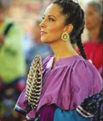 ANISSA GRAVES enters the dance arena for the grand entry during the CPN Family Reunion Festival in June 2019. Photo provided by Citizen Potawatomi Nation.