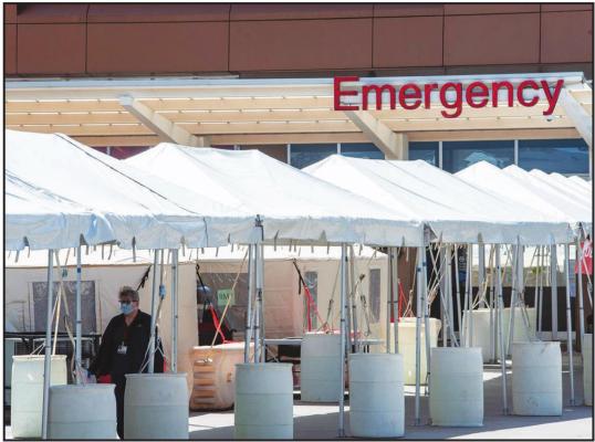 TENTS ARE set up outside of the emergency room at OU Medical Center where patients are being evaluated before entering the building — one of the hospital’s new protocols prompted by the coronavirus outbreak. (Whitney Bryen/Oklahoma Watch)