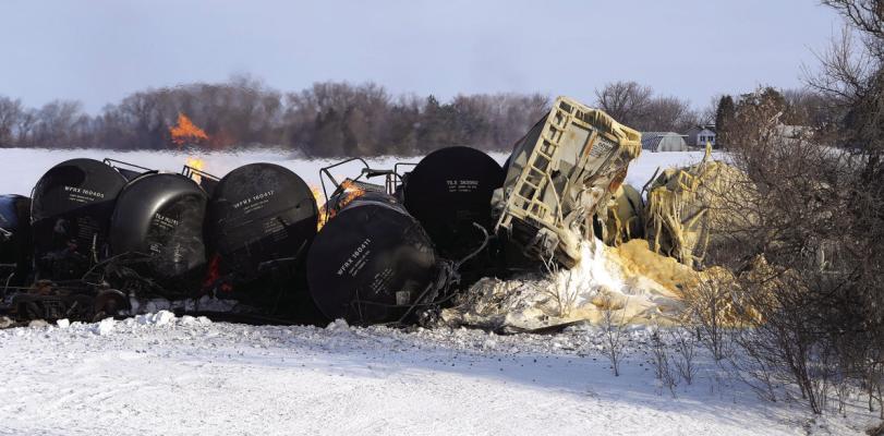 A BNSF train carrying ethanol and corn syrup derailed and caught fire in the west-central Minnesota town of Raymond early Thursday, March 30, 2023, and residents living near the scene were evacuated in the middle of the night. (David Joles/Minneapolis Star Tribune/TNS)