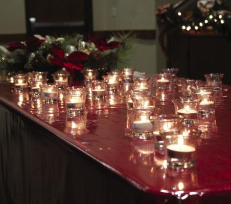 During the ceremony, votive candles were lit in remembrance of loved ones who have passed. (Photo by Calley Lamar)