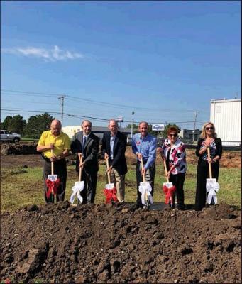 BREAKING GROUND on the new bank building at Fifth Street and Prospect are (l-r) Ponca City Mayor Homer Nicholson, Dan Mildfelt, President and CEO/Director of Community National Bank &amp; Trust, Mike Mildfelt, President of the Winfield CNB&amp;T Branch, Brett Austin, local branch President, Shasta Scott and Natalie Prather, both Vice Presidents of the local CNB&amp;T branch (News Photo by Mike Seals)