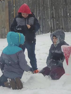 Siblings Ethan Pappan,14, Abbie Pappan,12, and Bladen Pappan,11 all play in the snow as we have received record breaking snowfall and below freezing temperatures in the area.(Photo provided by Mindy Pappan).