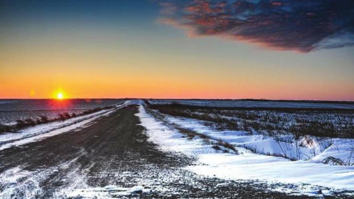 The sunset is beautiful on this snow covered dirt road in Kay County. Some of the snow drifts were all the way across the dirt roads and were two feet deep! (Photo provided by Amber Allen).