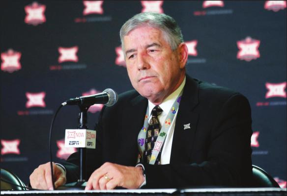 IN THIS MARCH 11, 2020, file photo, Big 12 Commissioner Bob Bowlsby announces no fans will be admitted to the rest of the Big 12 basketball tournament, in Kansas City, Kan. After the Power Five conference commissioners met Sunday, Aug. 9, 2020, to discuss mounting concern about whether a college football season can be played in a pandemic, players took to social media to urge leaders to let them play. (AP Photo/Orlin Wagner, File)