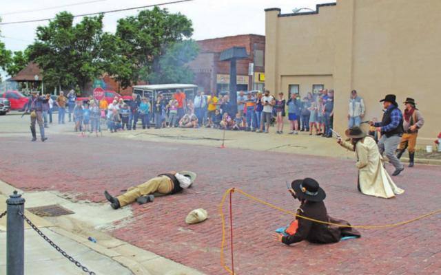 A wild west shootout reenactment that immediately followed the Tonkawa Film Festival Parade featuring the Guthrie Gunfighters. (Photo by Calley Lamar)