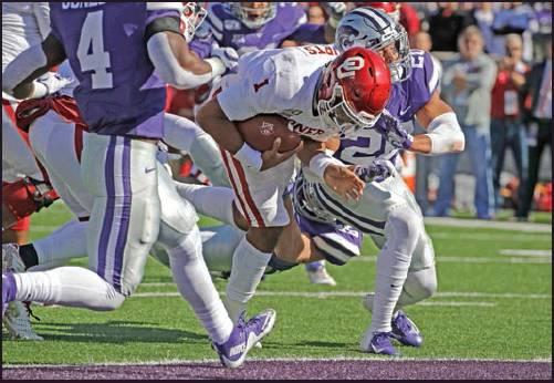 OKLAHOMA QUARTERBACK Jalen Hurts (1) gets past Kansas State defensive back Denzel Goolsby (20) to score a touchdown during a football game Oct. 26 in Manhattan, Kan. (AP Photo)