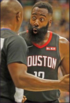 HOUSTON ROCKETS shooting guard James Harden (13), center, reacts to a referee’s call against him an NBA preseason game against the Los Angeles Clippers Thursday in Honolulu. The NBA also had a game in India. (AP Photo)