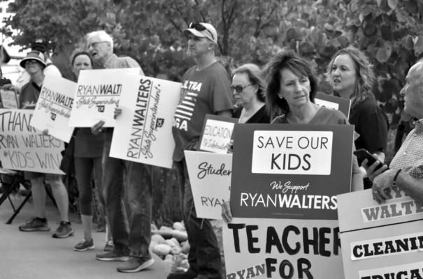 SUPPORTERS OF State Superintendent of Public Education Ryan Walters lined up outside the Oliver Hodge Building before the State Board of Education meeting on Thursday in Oklahoma City. (Yasmeen Saadi/Oklahoma Watch)