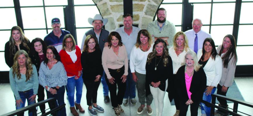 Russ (center) and Tracy Didlake (left of Russ) with Keller Williams Select purchased the 120-acre property in 2013. Pictured are the Didlakes are pictured with the rest of the staff at Keller Williams Select. (Photo by Calley Lamar)