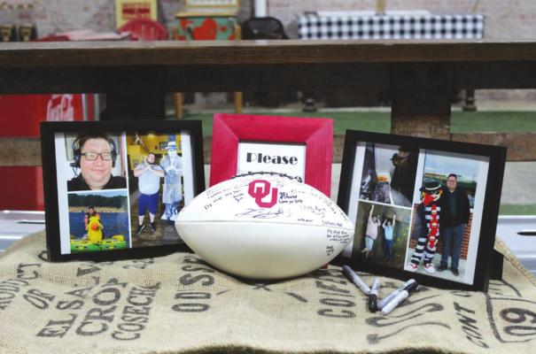 A celebration of life for Ben “Big Ben” Welch was held at The Axe Hole on Thursday, July 21. Welch was the voice of pee wee football, Tonkawa Buccaneers, Frontier Mustangs and 104.7 the Bull. Pictured is a football that guests signed as they entered. (Photo by Calley Lamar)