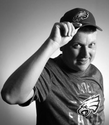 SERGEI ZHERDEV is a Ukrainian refugee who came to Philadelphia in January and acclimated to America by becoming a Philadelphia Eagles fan during the team’s Super Bowl run. He is shown in his hat and T-shirt on Aug. 9, 2023. (Charles Fox/The Philadelphia Inquirer/TNS)