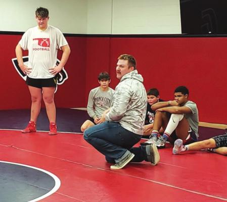 State Champion visits with wrestlers