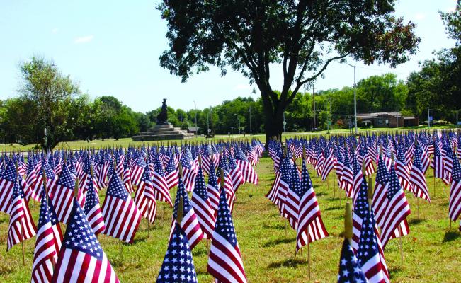 VOLUNTEERS ARE needed to assist in the placement of 2,977 flags, each representing a victim that lost their life on 9/11. Pictured are the flags from last year. Volunteers interested in assisting with placement will need to meet at the Pioneer Woman Statue Park at 1 pm on Sunday, Sept. 3. (Photo by Dailyn Emery)