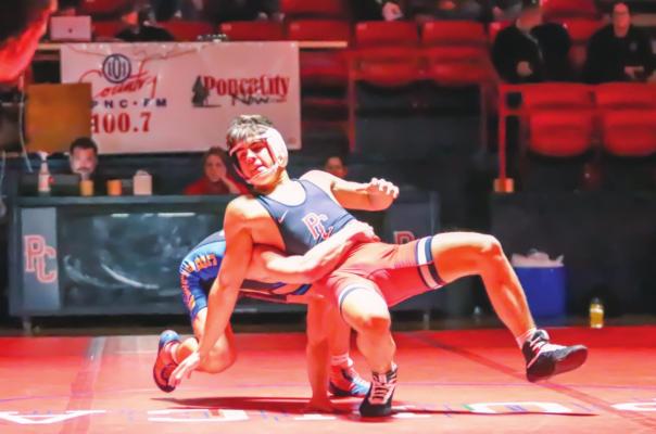 PRESTON LEE of Ponca City tries to escape the grasp of his Choctaw opponent during dual wrestling action Tuesday at Robson Field House. Lee eventually lost a 4-2 decision. Choctaw won the dual, which was a Senior Night event for Ponca City, 40-27. This photo was provided by Justin Boyer.